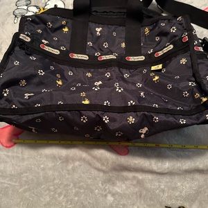 LeSportsac Snoopy and Woodstock overnight bag with small cosmetic bag.